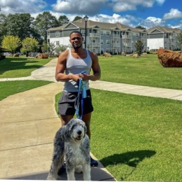 a person outdoors walking a dog