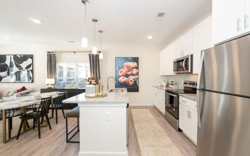 a kitchen with white cabinets